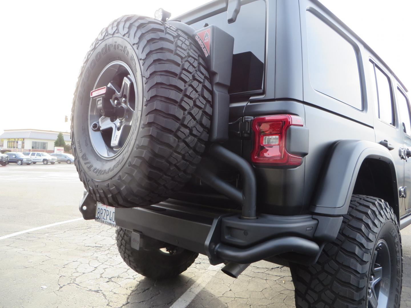 2020 BLACK /BLACK Jeep Wrangler Unlimited Rubicon (1C4HJXFGXLW) with an 3.6L V6 DOHC 24V FFV engine, 6A transmission, located at 2630 Grass Valley Highway, Auburn, CA, 95603, (530) 508-5100, 38.937893, -121.095482 - STANDARD CONTENT AEV RX Front Bumper AEV Front Skid Plate AEV Non-Winch Cover Plate AEV 7000 Series Lights AEV Light Cover Kit AEV 2.5" DualSport RT Suspension System AEV Front Geometry Correction Brackets AEV Steering Stabilizer AEV Rear Bumper AEV Swing-Out Tire Carrier AEV CHMSL Mount - Photo#14